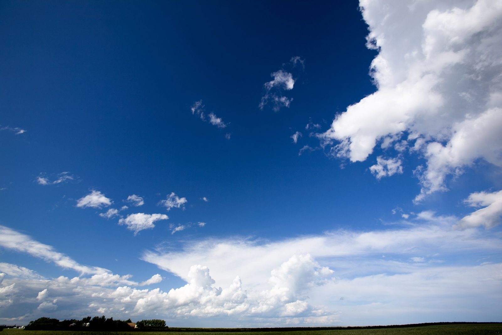 560369_big-sky-background-min A landscape with a big sky with clouds.